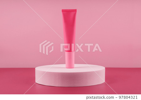 Color of the year 2023 Viva magenta. Cosmetic product on podium pedestal. 97804321