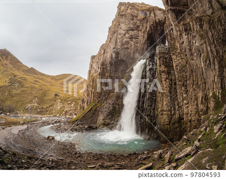 Autumn mountains in autumn morning. Gil-Su waterfall in wide autumn valley in North Caucasus, Russia. Beautiful landscape. 97804593