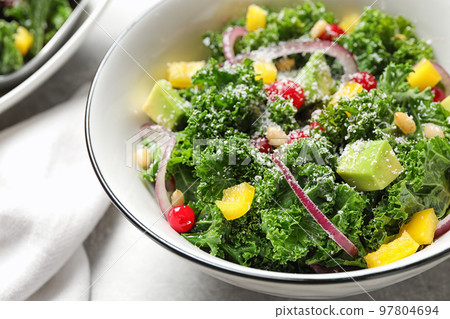 Tasty fresh kale salad on grey table, closeup 97804694