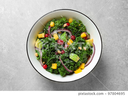 Tasty fresh kale salad on light grey table, top view Tasty fresh kale salad on light grey table, top view 97804695