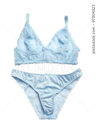 Elegant light blue women's underwear isolated on white, top view 97804825