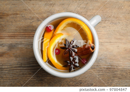Aromatic mulled wine on wooden table, top view Aromatic mulled wine on wooden table, top view 97804847