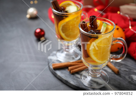 Aromatic white mulled wine on grey table. Space for text Aromatic white mulled wine on grey table. Space for text 97804852