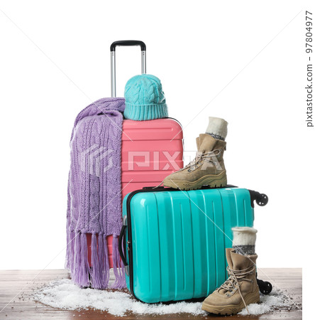 Suitcase with warm clothes isolated on white. Winter vacation Suitcase with warm clothes isolated on white. Winter vacation 97804977