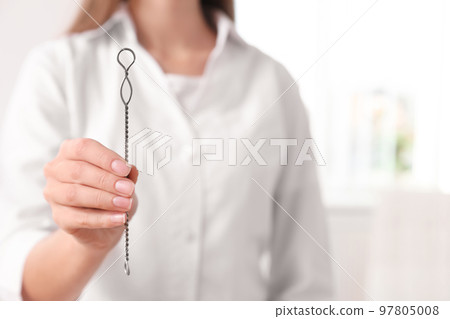 Speech therapist with logopedic probe in clinic, closeup. Space for text Speech therapist with logopedic probe in clinic, closeup. Space for text 97805008