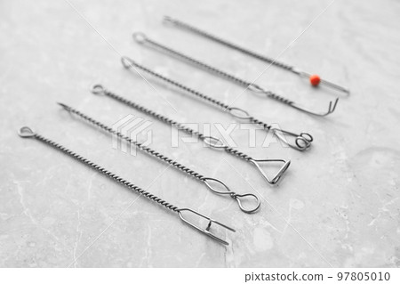 Set of different logopedic probes on marble table. Speech therapist's tools Set of different logopedic probes on marble table. Speech therapist's tools 97805010