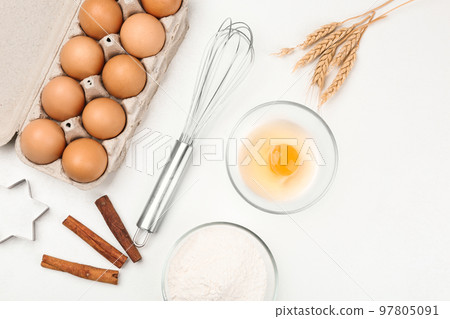 Flat lay composition with raw eggs and other ingredients on white table. Baking pie Flat lay composition with raw eggs and other ingredients on white table. Baking pie 97805091