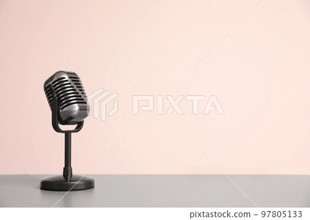 Vintage microphone on light grey table, space for text Vintage microphone on light grey table, space for text 97805133