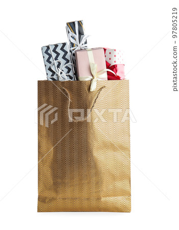 Shopping paper bag with presents isolated on white Shopping paper bag with presents isolated on white 97805219