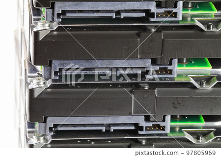 pile or stack of HDD, SSHD Hybrid hard disk drives 3.5" standard profile show on SATA interface, isolated on white background pile or stack of HDD, SSHD Hybrid hard disk drives 3.5" standard profile show on SATA interface, isolated on white background 97805969