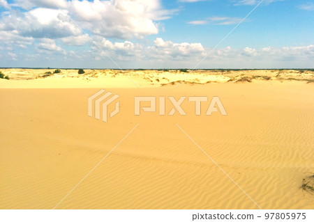 Lonely sand dunes under cloudy sky at drought desert landscape. 97805975