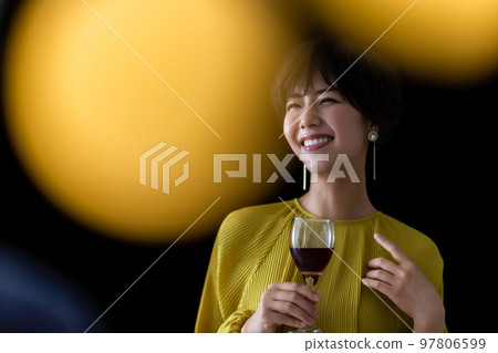 Nice woman with short hair drinking wine Nice woman with short hair drinking wine 97806599