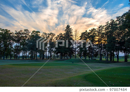 Late autumn sunset sky and golf course autumn season 97807484
