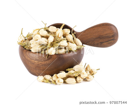 Dry jasmine flowers in wooden bowl and spoon, isolated on white background. Jasmine flowers tea. Herbal tea. 97807544