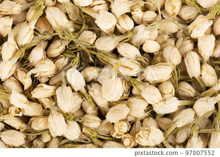 Dry jasmine flowers background. Jasmine flowers tea. Herbal tea. Top view. 97807552