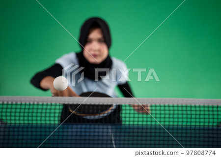 ball crosses the net with female player ready to hit ball crosses the net with female player ready to hit 97808774