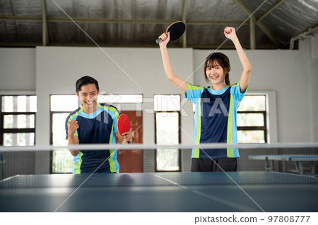 ping pong doubles players excited when they score 97808777