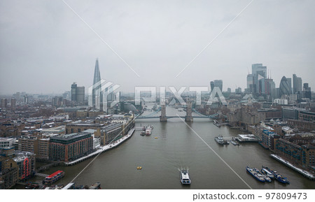 London and Tower Bridge over River Thames on a foggy day 97809473