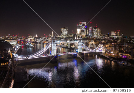 London Tower Bridge and City of London by night - amazing aerial view London Tower Bridge and City of London by night - amazing aerial view 97809519