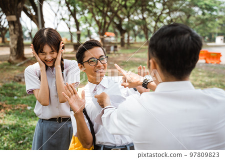 Geeky student threatened when with a girl Geeky student threatened when with a girl 97809823