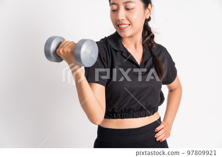 asian woman lifting dumbbells while exercising biceps on white background asian woman lifting dumbbells while exercising biceps on white background 97809921