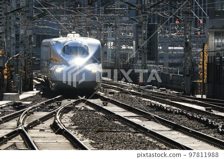 Incoming Shinkansen Nozomi leading car silhouette 97811988