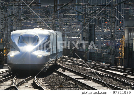 Incoming Shinkansen Nozomi leading car silhouette Incoming Shinkansen Nozomi leading car silhouette 97811989