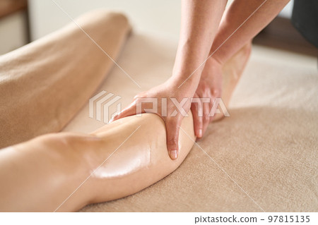 Woman receiving foot massage at beauty salon Woman receiving foot massage at beauty salon 97815135