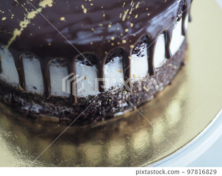 dark chocolate frosted drip cake with best wishes topping written in italian dark chocolate frosted drip cake with best wishes topping written in italian 97816829