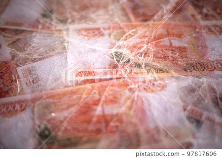 Five thousand rubles are thawed in ice. The Russian currency is frozen. 97817606