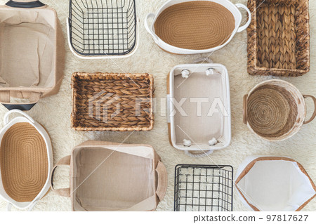 Flat lay of storage boxes; containers and baskets with different sizes and shapes Flat lay of storage boxes; containers and baskets with different sizes and shapes 97817627