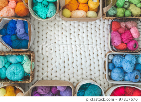 Many baskets made of natural eco-friendly materials. Multicolor yarn for knitting, knitting needles Many baskets made of natural eco-friendly materials. Multicolor yarn for knitting, knitting needles 97817670