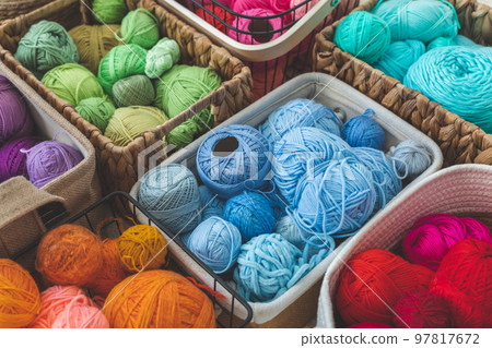 Many baskets made of natural eco-friendly materials. Multicolor yarn for knitting, knitting needles  97817672