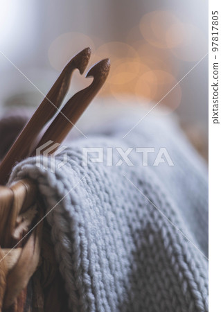 Cozy homely atmosphere. Heart from hooks for knitting. Yarn in neutral colors. 97817805