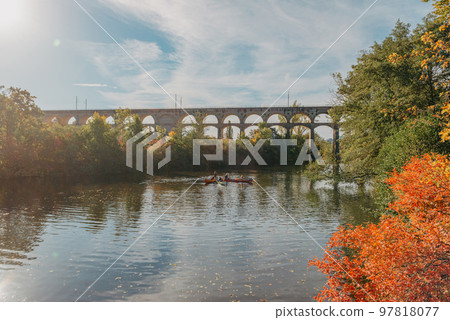 Railway Bridge with river in Bietigheim-Bissingen, Germany. Autumn. Railway viaduct over the Enz River, built in 1853 by Karl von Etzel on a sunny summer day. Bietigheim-Bissingen, Germany. Old Railway Bridge with river in Bietigheim-Bissingen, Germany. Autumn. Railway viaduct over the Enz River, built in 1853 by Karl von Etzel on a sunny summer day. Bietigheim-Bissingen, Germany. Old 97818077