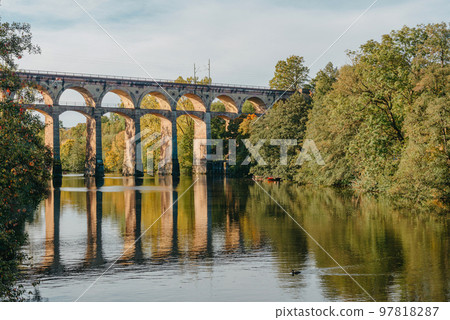 Railway Bridge with river in Bietigheim-Bissingen, Germany. Autumn. Railway viaduct over the Enz River, built in 1853 by Karl von Etzel on a sunny summer day. Bietigheim-Bissingen, Germany. Old Railway Bridge with river in Bietigheim-Bissingen, Germany. Autumn. Railway viaduct over the Enz River, built in 1853 by Karl von Etzel on a sunny summer day. Bietigheim-Bissingen, Germany. Old 97818287