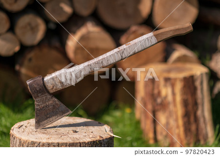 Photography on theme big steel axe with wooden handle 97820423