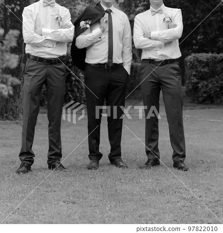 Groom and groomsman in park Groom and groomsman in park 97822010