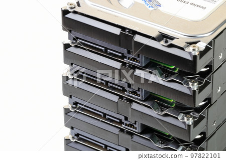 pile or stack of HDD, SSHD Hybrid hard disk drives 3.5" standard profile show on SATA interface, isolated on white background 97822101