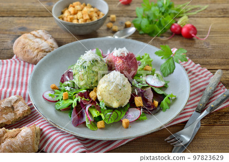 South Tyrolean dumpling trio, consisting of the three different kinds spinach, cheese and beetroot South Tyrolean dumpling trio, consisting of the three different kinds spinach, cheese and beetroot 97823629