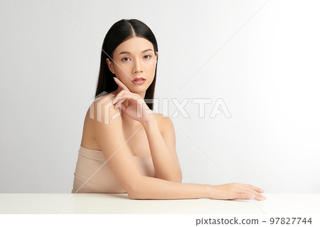 Beautiful young asian woman with clean fresh skin on white background, Face care, Facial treatment, Cosmetology, beauty and spa, Asian women portrait. Beautiful young asian woman with clean fresh skin on white background, Face care, Facial treatment, Cosmetology, beauty and spa, Asian women portrait. 97827744