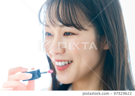 A woman wearing a lipstick A woman wearing a lipstick 97829622