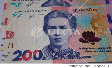 Bills of 200 UAH on the table. Panorama 97834101
