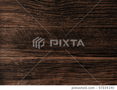 板牆表面的背景圖像，上面覆蓋著深褐色的舊木頭，這些木頭已經風化，木紋很深 97834140