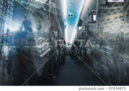 Aircraft interior with aisle and airplane seats 97834973