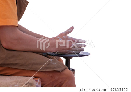 Potter makes a clay pot on potters wheel. Pottery and craftsmanship concept.  Isolate on white background. 97835102