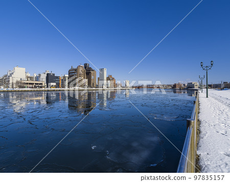 Kushiro River in winter with thin ice in Hokkaido / Kushiro, Japan 97835157