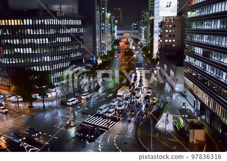 Night view of business district after rain Night view of business district after rain 97836316