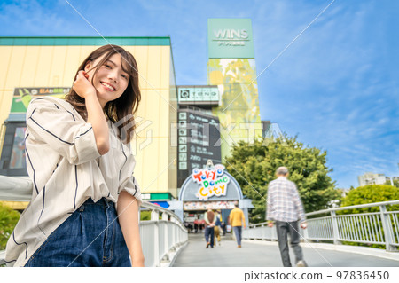 Smiling young woman Suidobashi Station 97836450