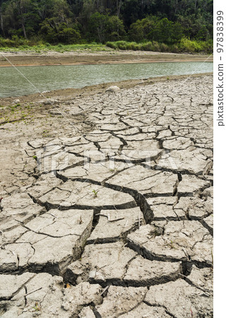 Dry lake bed with the natural texture of cracked clay on the perspective floor. Dry lake bed with the natural texture of cracked clay on the perspective floor. 97838399